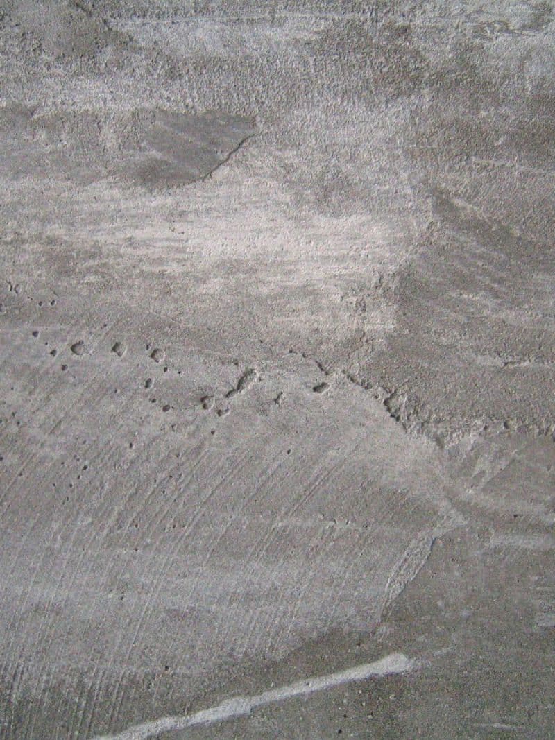 Referenzwebsite: Grauer Wandputz als Materialbild auf einer Website eines Architekten